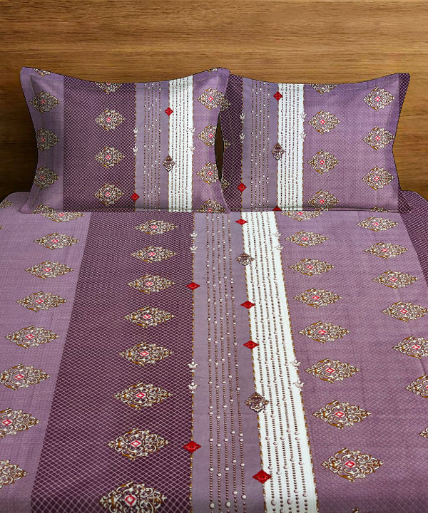 Purple bedspread with floral patterns on a wooden background